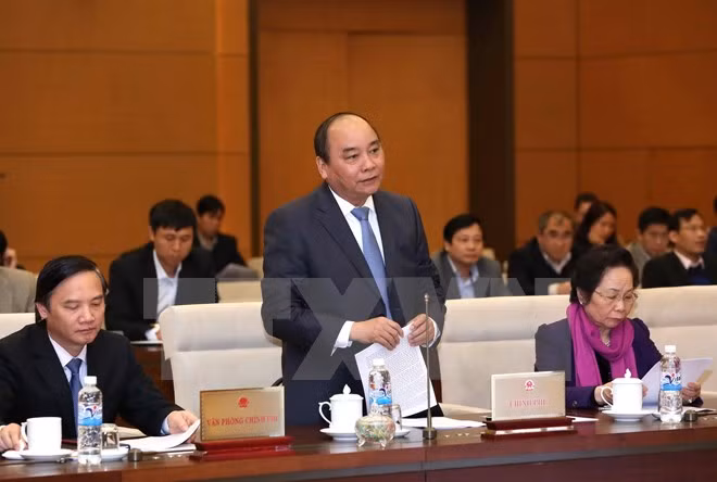 Parlamento vietnamita escruta informe de trabajo de gobierno y premier ảnh 1