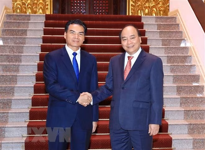 Laos interesado en adquirir experiencias de Vietnam en gestión macroeconómica ảnh 1