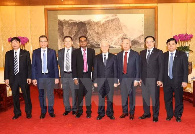 Líder partidista vietnamita recibe a dirigentes de AIIB y de grupo Sunwah ảnh 1