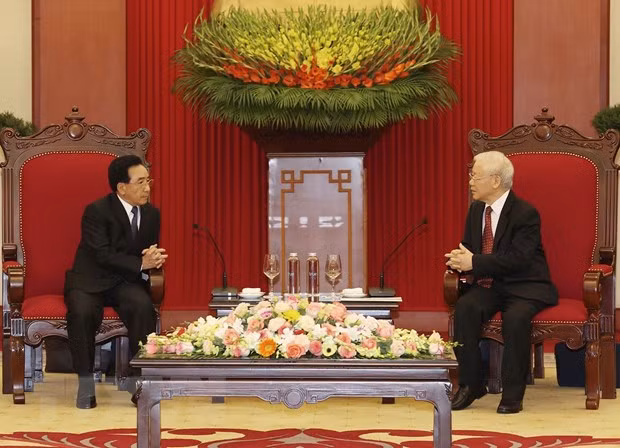 Máximo dirigente partidista de Vietnam recibe al primer ministro de Laos ảnh 1