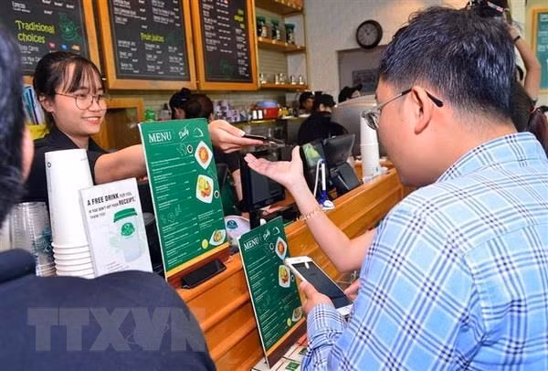 Promueven en Vietnam pago electrónico para prevenir el contagio del nCoV ảnh 1