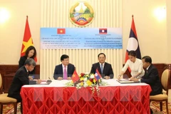 Firman Vietnam y Laos acuerdos de cooperación