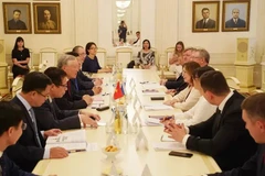 El presidente del Tribunal Popular Supremo de Vietnam, Nguyen Hoa Binh, y su homóloga rusa Irina Podnosova.