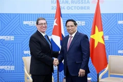El primer ministro de Vietnam, Pham Minh Chinh, y el ministro de Relaciones Exteriores de Cuba, Bruno Rodríguez Parrill. (Foto: VNA)