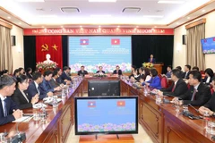 Vietnam y Laos intercambian experiencias en movilización de masas