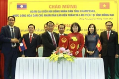 Provincias de Vietnam y Laos intercambian experiencias en actividades de consejos populares