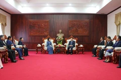 Comparten Vietnam y Laos experiencias en movilización de masas