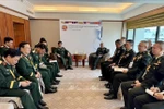 El coronel general Nguyen Van Nghia, subjefe del Estado Mayor General, se reúne con representantes de Tailandia en el marco de ACAMM-26. (Fuente: VNA)
