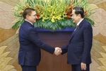 El presidente de la Asamblea Nacional de Vietnam, Tran Thanh Man, recibe al primer vicepresidente del Consejo de la Federación y secretario del Consejo General del Partido Rusia Unida, Vladimir Yakushev. (Fuente: VNA)