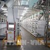 La fábrica de hilos de la empresa Unitex Textile and Dyeing aplica nueva tecnología para optimizar las operaciones mediante un modelo automatizado. Foto: VNA