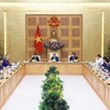 El primer ministro Pham Minh Chinh se reunió con representantes de empresas estadounidenses que invierten y operan en Vietnam. Foto: VNA.