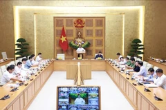 El primer ministro Pham Minh Chinh preside la reunión. (Foto: VNA)