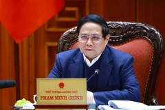 El primer ministro Pham Minh Chinh habla en la reunión. (Foto: VNA)