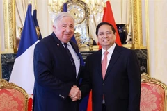 El primer ministro de Vietnam, Pham Minh Chinh, se reúne con el presidente del Senado francés, Gérard Larcher. (Foto: VNA)