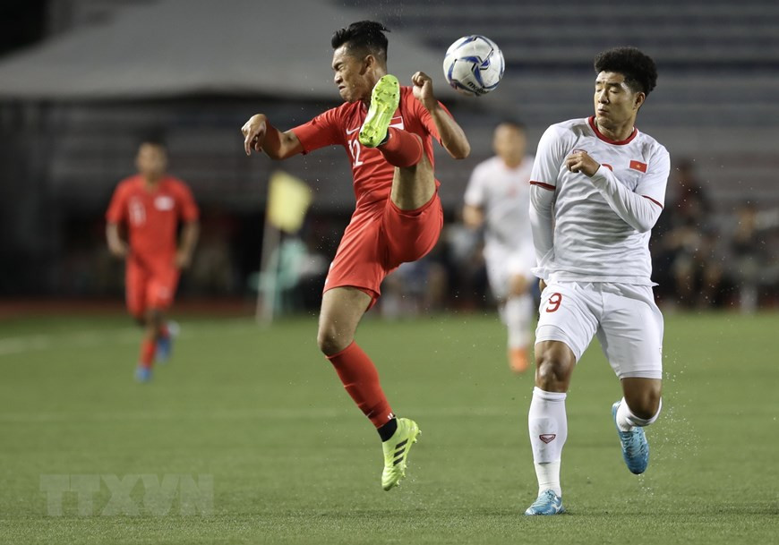 El equipo nacional enfrentó dificultades ante la gran exhibición de defensiva de los singapurenses (Foto: VNA)