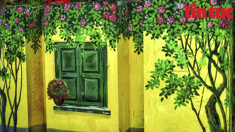 Se espera que esta calle llena de frescos sea siempre un punto culminante para los pobladores locales y turistas que llegan al distrito de Long Bien. (Fuente:VNA)