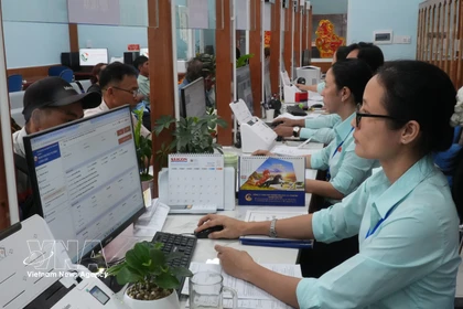 Las habilidades digitales son una "llave" importante para ayudar a los funcionarios públicos a resolver su trabajo de la manera más eficiente. Foto: VNA