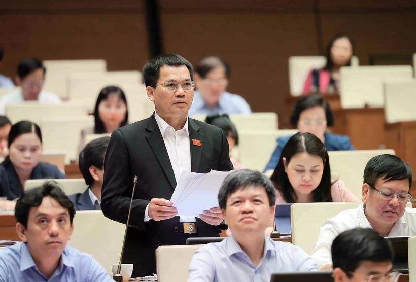Los delegados discuten los proyectos de ley presentados a la Asamblea Nacional. (Foto: VNA)