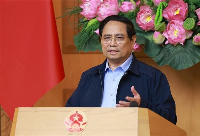 El primer ministro de Vietnam, Pham Minh Chinh, habla en la reunión. (Foto: VNA)
