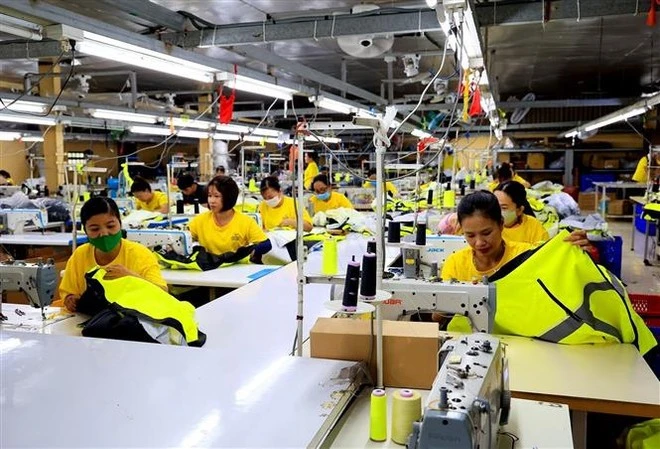 Trabajadores de la empresa textil Dony, comuna de Vinh Loc A, distrito de Binh Chanh, Ciudad Ho Chi Minh. (Foto: VNA)