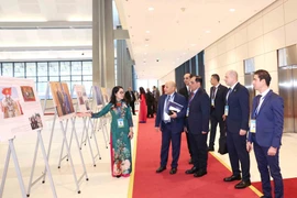 Exposición fotográfica de la VNA en la ceremonia de firma de Convención de Hanoi