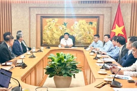 Delegados en la sesión de trabajo (Foto: VNA)
