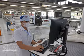 Las exportaciones de prendas de vestir contribuyen de manera importante al crecimiento. (Foto: VNA)