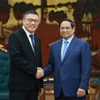 El primer ministro de Vietnam, Pham Minh Chinh, recibe a Hong Tianzhu, presidente del Grupo Texhong de China. (Fuente: VNA)