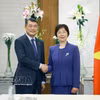 El primer ministro de Vietnam, Le Minh Hung, y Zou Jiayi, presidenta del Banco Asiático de Inversión en Infraestructuras. Foto: VNA