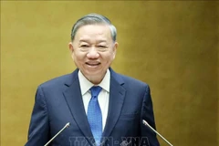 El secretario general del Partido, To Lam, interviene en la conferencia nacional celebrada en Hanoi el 18 de mayo sobre la difusión e implementación de las Resoluciones 66 y 68. (Foto: VNA)