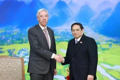 El primer ministro Pham Minh Chinh (dcha.) y el ministro portugués de Relaciones Exteriores, Joao Gomes Cravinho (Foto: VNA)