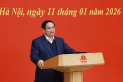 El miembro del Buró Político y secretario del Comité del Partido del Gobierno, el primer ministro Pham Minh Chinh, habla en la conferencia. (Foto: VNA)