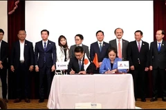 Delegados en la ceremonia de firma (Foto: VNA)