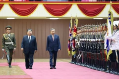 La ceremonia de bienvenida al secretario general To Lam se celebró solemnemente en el Palacio de Deportes de Pionyang. (Foto: VNA)