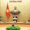 El primer ministro Pham Minh Chinh preside la reunión del Gobierno. (Foto: VNA)