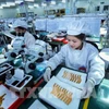 Línea de prueba de circuitos electrónicos en una empresa surcoreana en el parque industrial de Yen Phong. (Foto: VNA)