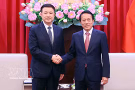 El ministro de Seguridad Pública de Vietnam, Luong Tam Quang, y su homólogo chino, Wang Xiaohong. (Fuente: VNA)