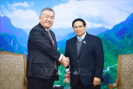 El primer ministro de Vietnam, Pham Minh Chinh (derecha), recibe al director ejecutivo y presidente de Yamato Holdings, Nagao Yutaka (Foto: VNA)