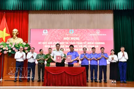 Intercambio sobre el mecanismo de cooperación entre la Auditoría Estatal de Vietnam y la Fiscalía Popular Suprema durante la reunión. (Foto: VNA)