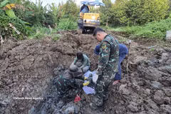 El equipo K91 buscó y recolectó muchos restos de soldados caídos en los huertos de durian de los residentes locales en la aldea de Binh Hoa de la provincia de Dong Thap. Foto: VNA