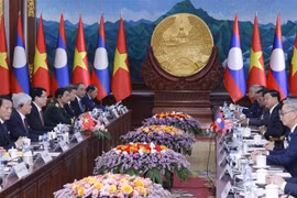 En la reunión entre el presidente de Vietnam, Luong Cuong y el secretario general del Partido Popular Revolucionario y presidente de Laos, Thongloun Sisoulith. (Fuente: VNA)