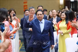 El primer ministro Pham Minh Chinh se reúne con la comunidad vietnamita residente en China (Fuente: VNA)