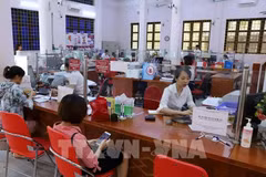 En una sucursal de Agribank en Lao Cai (Foto: VNA)