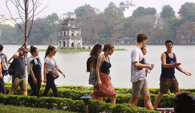 Turistas extranjeros esperan ansiosamente visitar Vietnam ảnh 2