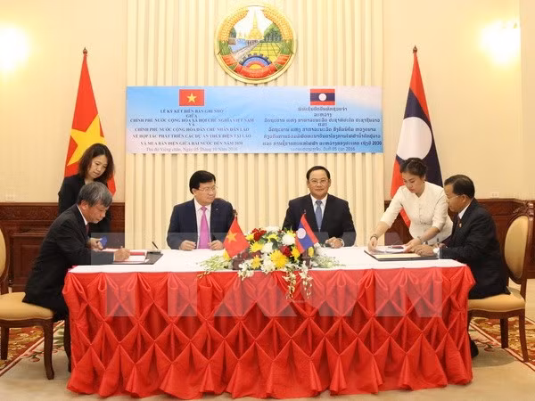 Firman Vietnam y Laos acuerdos de cooperación ảnh 1