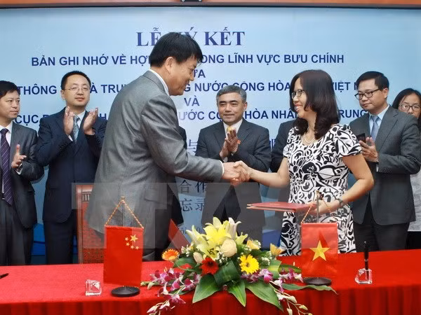 Firman memorando de colaboración Vietnam- China en correos ảnh 1
