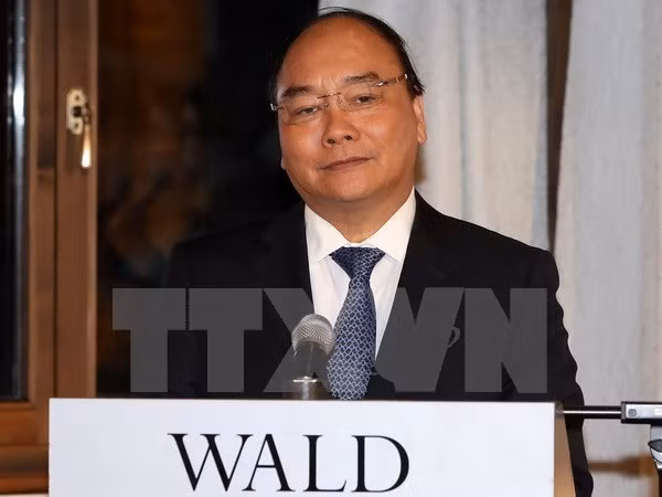 Primer ministro vietnamita dialoga con ejecutivos de FEM ảnh 1 Primer ministro vietnamita dialoga con ejecutivos de FEM ảnh 1