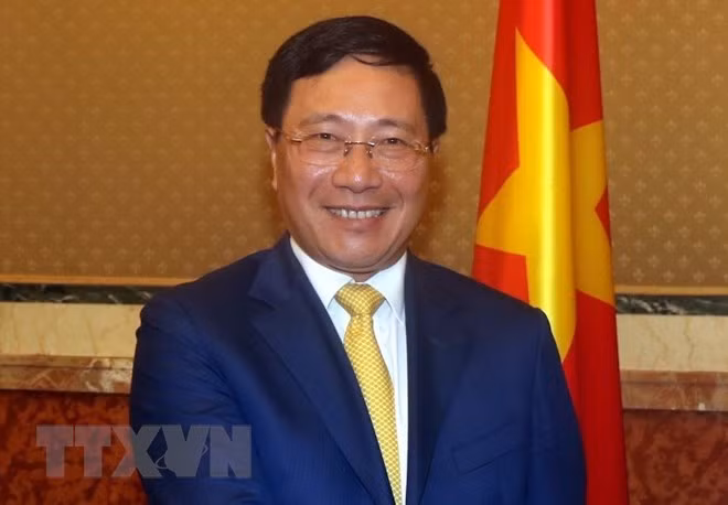 Vicepremier y canciller de Vietnam asiste al Foro empresarial con Reino Unido ảnh 1