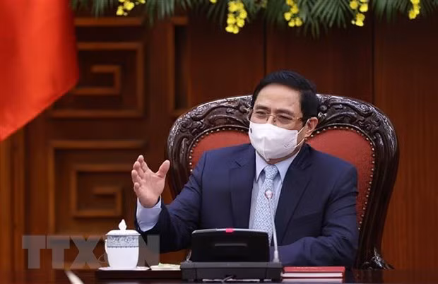 Optimista premier de Vietnam sobre resultados de lucha antiepidémica ảnh 1