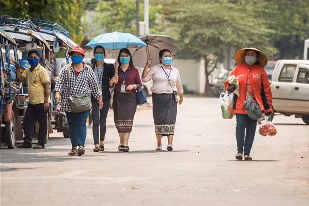 Laos insta a población a continuar manteniendo medidas anti-COVID-19 ảnh 1